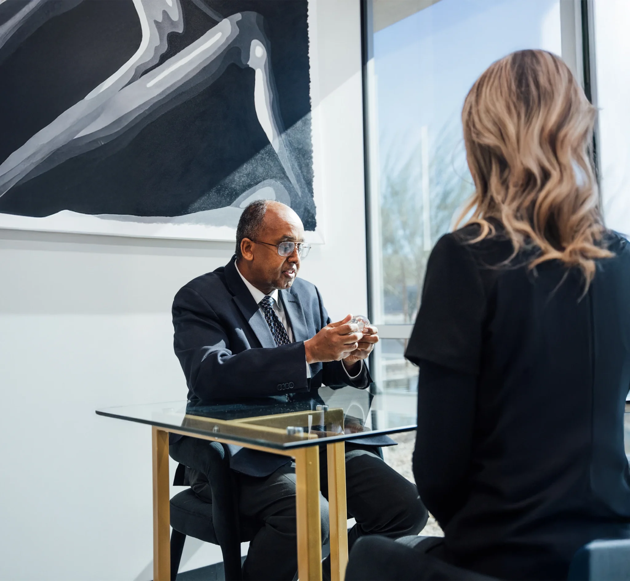 Doctor holding implant